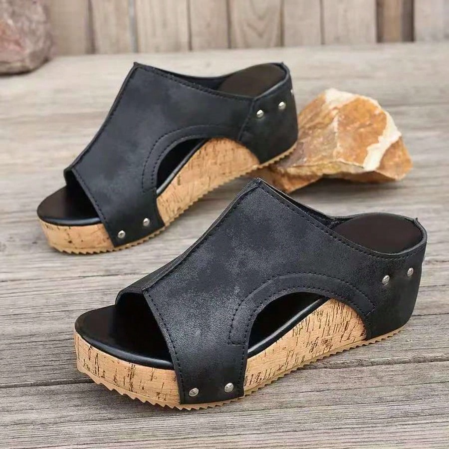 Women's plain slip-on slippers with a round toe, platform sole, and studded details, designed for casual daily wear and vacation outfits.