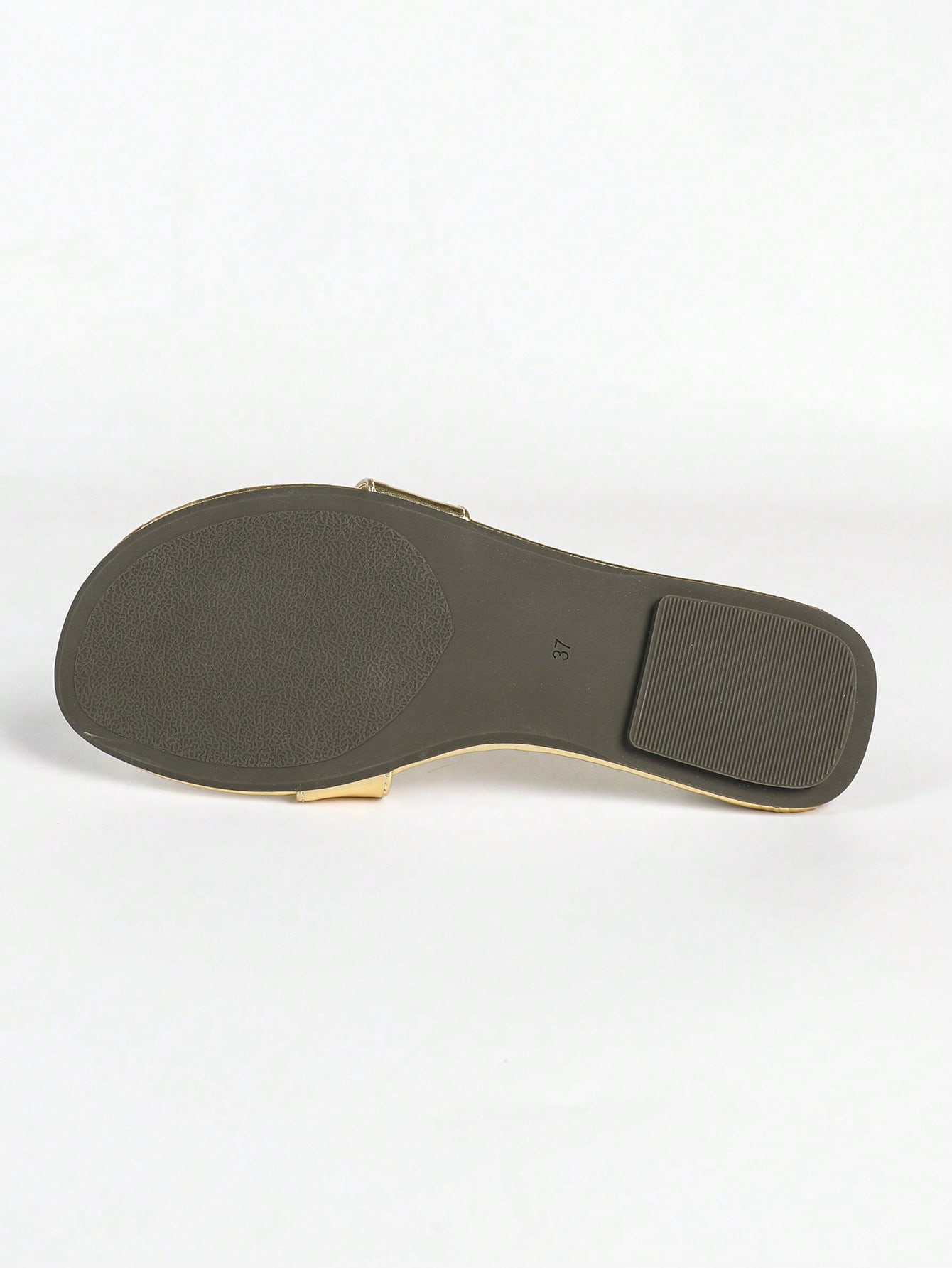 Women's gold flat sandals with metal accent detail, strappy lace-up design, and toe post thong style.