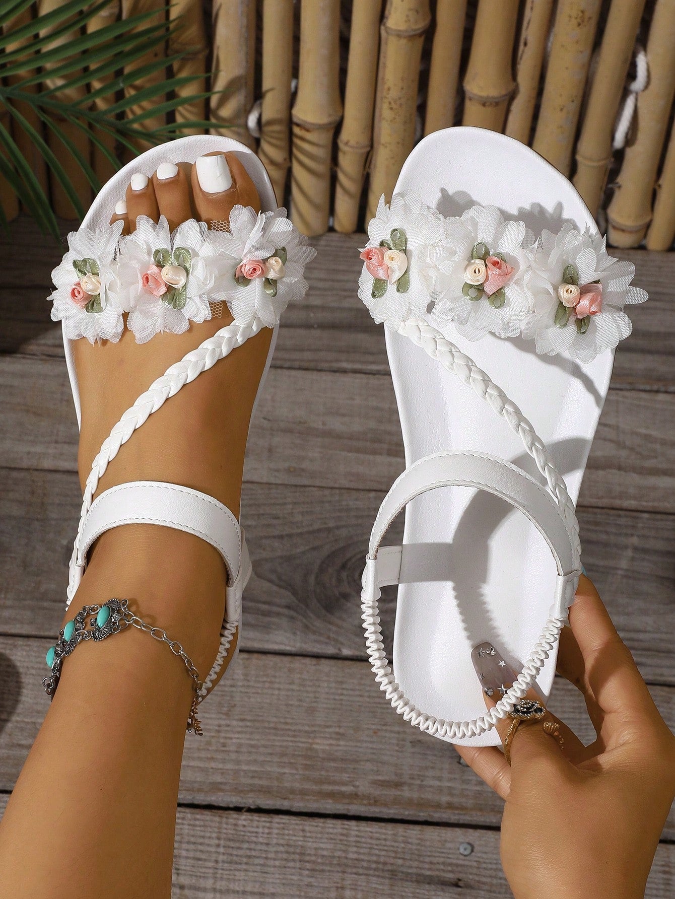 Women’s flat thong sandals featuring floral hollow-out details, open toe design, soft sole comfort, and elastic straps, suitable for beach, travel, party, wedding, and dress outfits.