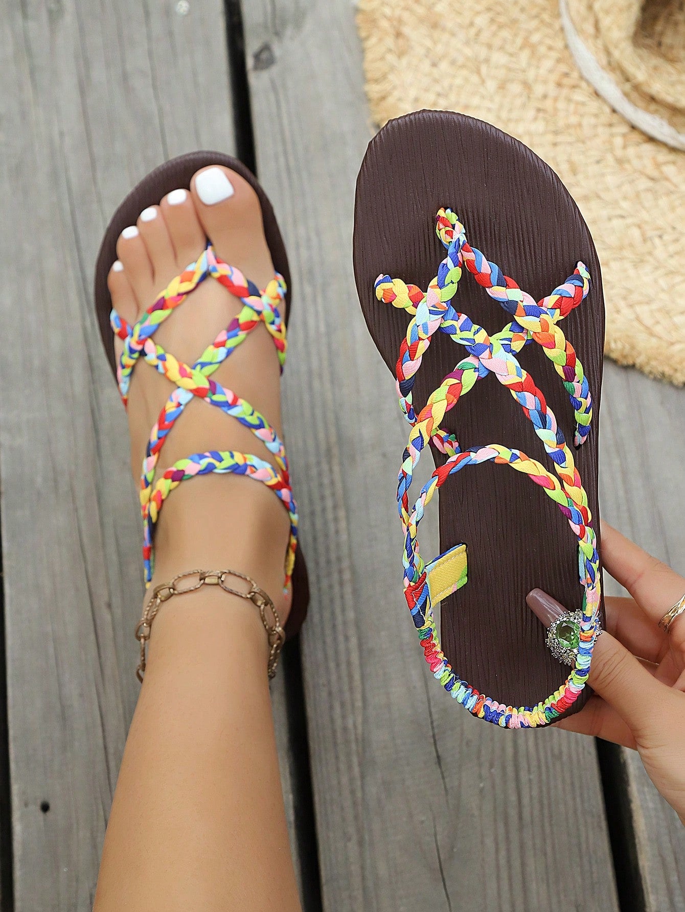 Open-toe flat slide sandals featuring rhinestone leaf decoration in a vacation-inspired style.