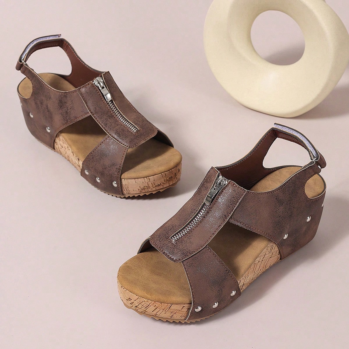 Women's plain slip-on slippers with a round toe, platform sole, and studded details, designed for casual daily wear and vacation outfits.