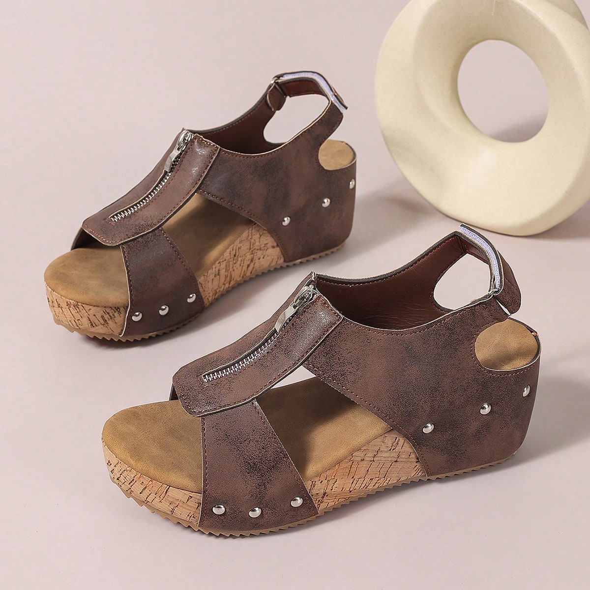 Women's plain slip-on slippers with a round toe, platform sole, and studded details, designed for casual daily wear and vacation outfits.