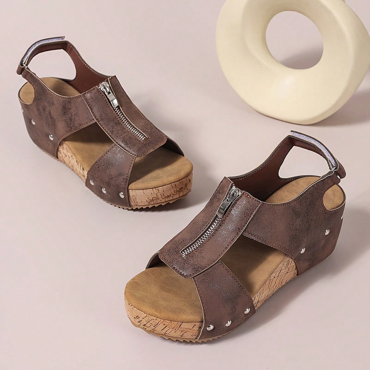 Women's plain slip-on slippers with a round toe, platform sole, and studded details, designed for casual daily wear and vacation outfits.