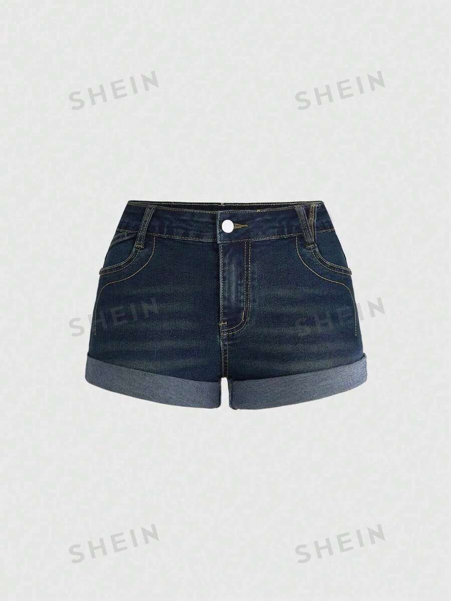 Blue washed shorts with butterfly embroidery, distressed detailing, ultra low waist, button closure, zipper fly, and pockets.