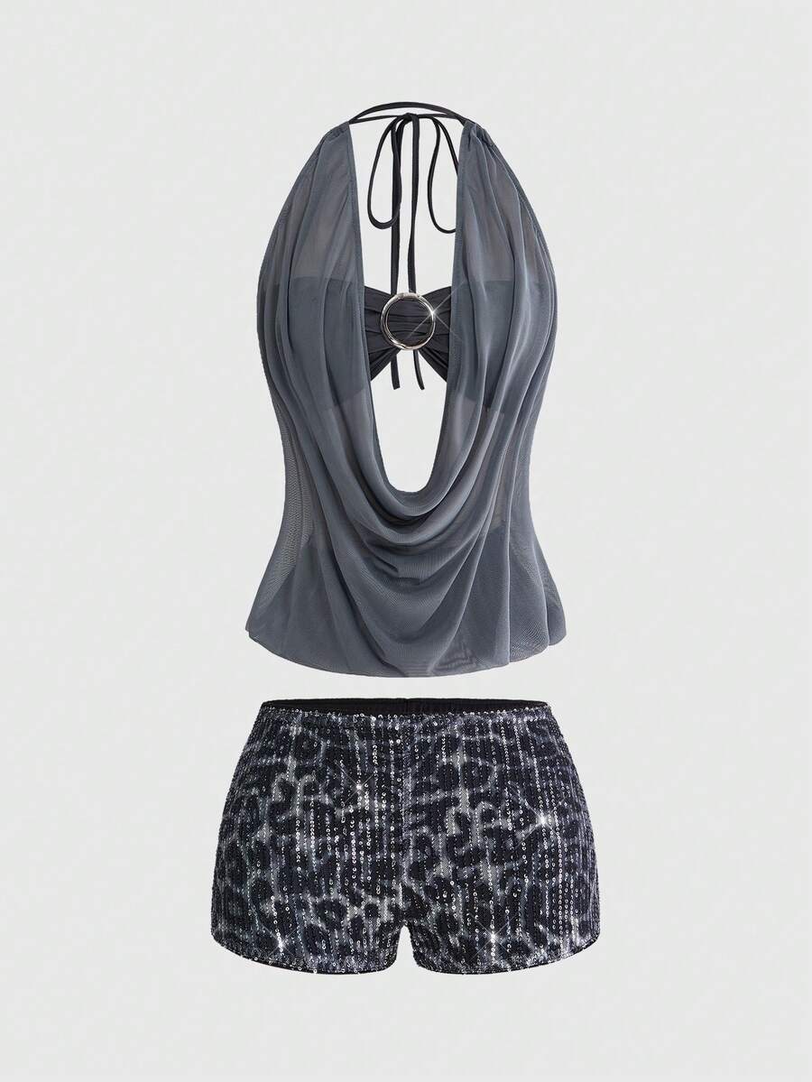 Women's two-piece outfit with a sleeveless halter cowl neck backless crop camisole, tie-back detail, bandeau inner, and leopard print shorts.