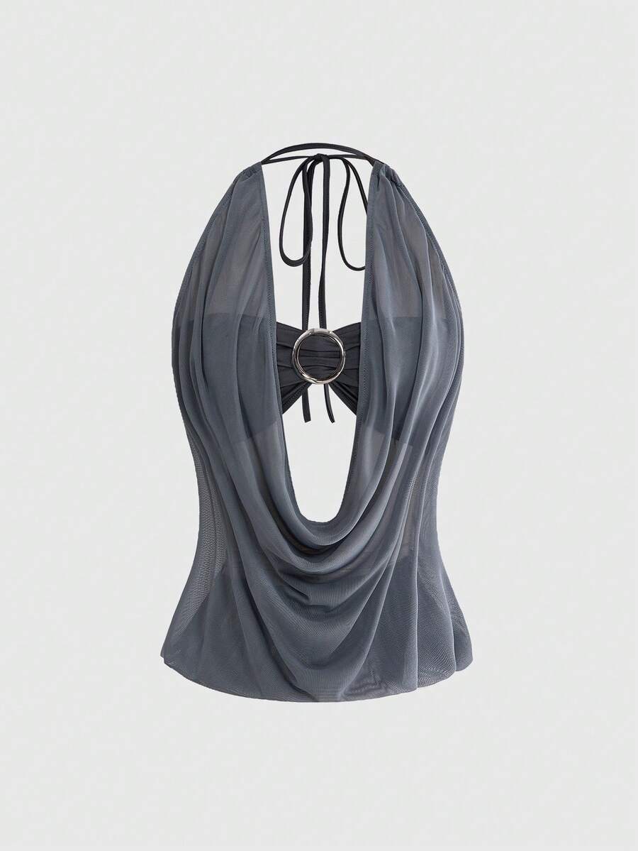 Women's two-piece outfit with a sleeveless halter cowl neck backless crop camisole, tie-back detail, bandeau inner, and leopard print shorts.
