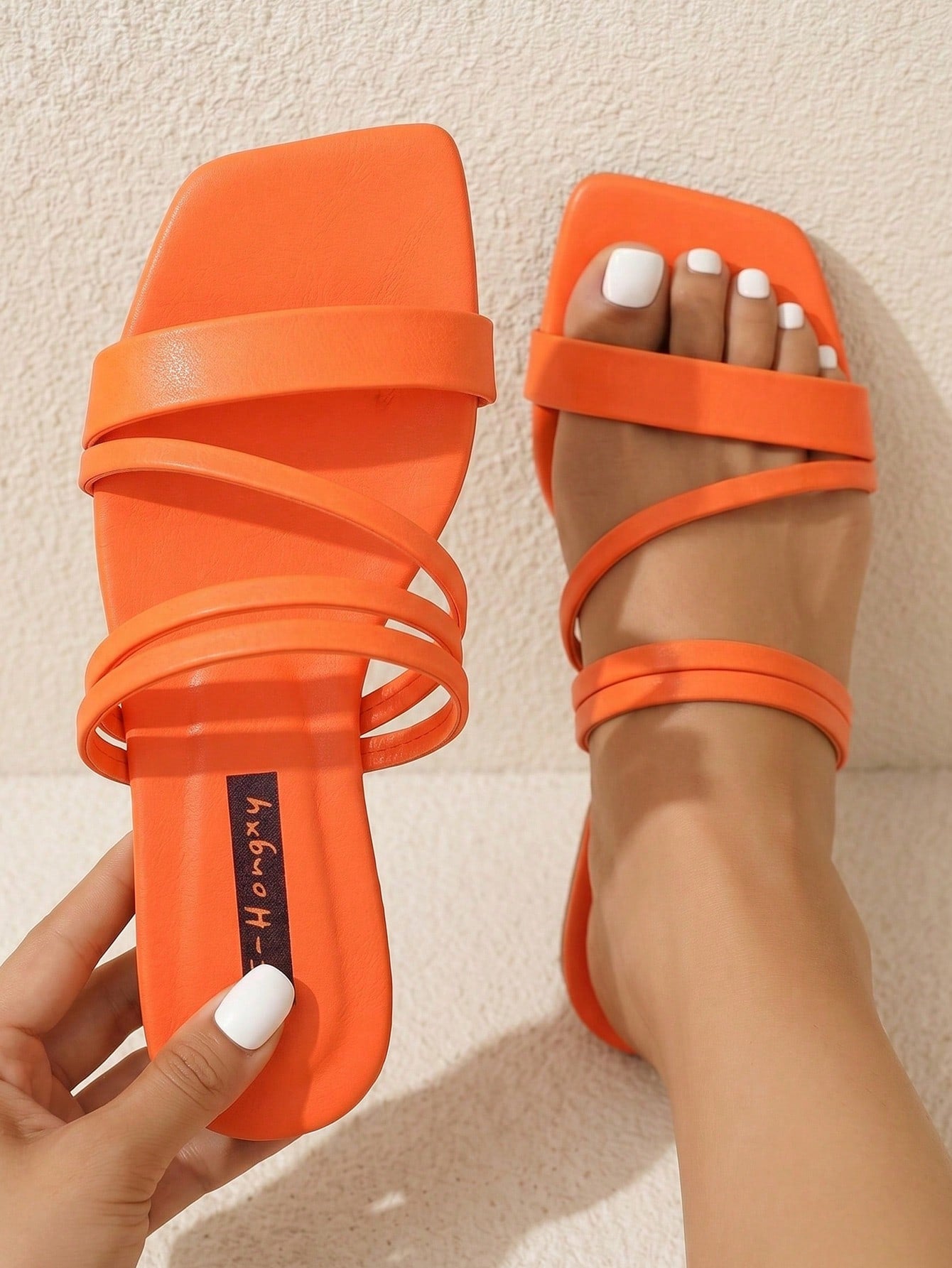 Women's striped flat slingback sandals with a square open toe, slip-on style, and rhinestone detail.