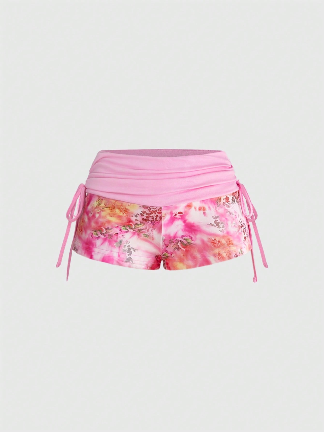 Women's low waist mini track shorts with elastic waistband, drawstring knot, ruched details, and plant pattern in a Y2K boho style