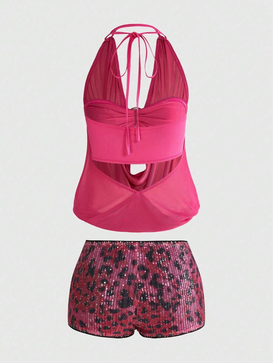 Women's two-piece outfit with a sleeveless halter cowl neck backless crop camisole, tie-back detail, bandeau inner, and leopard print shorts.