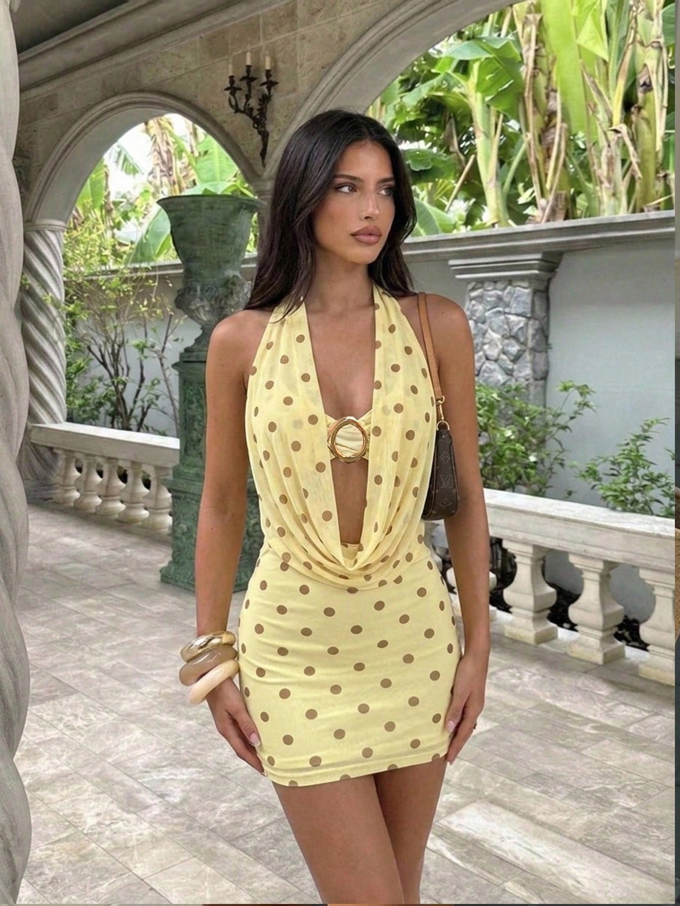 Women's sleeveless halter bodycon mini dress with backless cutout design and knot detail in apricot