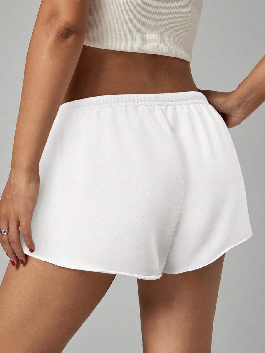 Petite women's burgundy casual track shorts with drawstring waist, raw hem, loose fit, and mini length