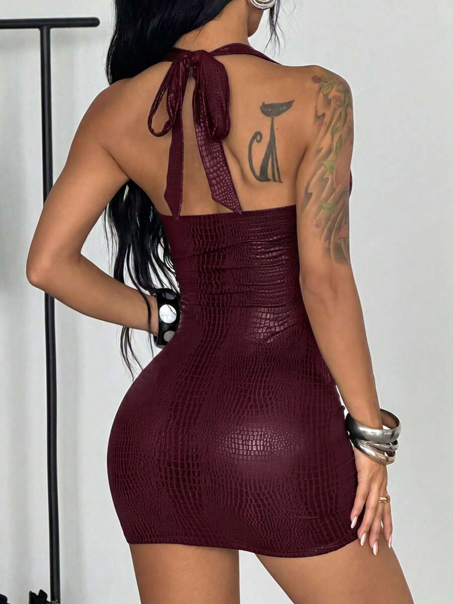 Women's sleeveless halter bodycon mini dress with studded details, cutout design, slim fit, and pencil hem