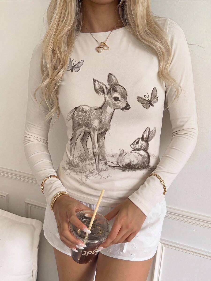 Casual CovetEZ long sleeve T-shirt with leopard-style random print, round neck, loose fit, and asymmetrical detail