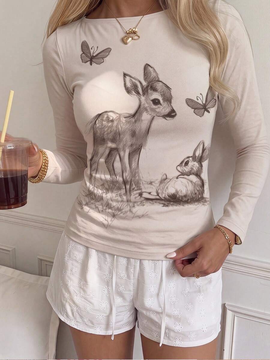 Casual CovetEZ long sleeve T-shirt with leopard-style random print, round neck, loose fit, and asymmetrical detail