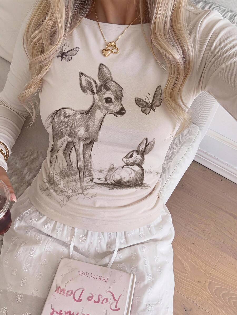 Casual CovetEZ long sleeve T-shirt with leopard-style random print, round neck, loose fit, and asymmetrical detail