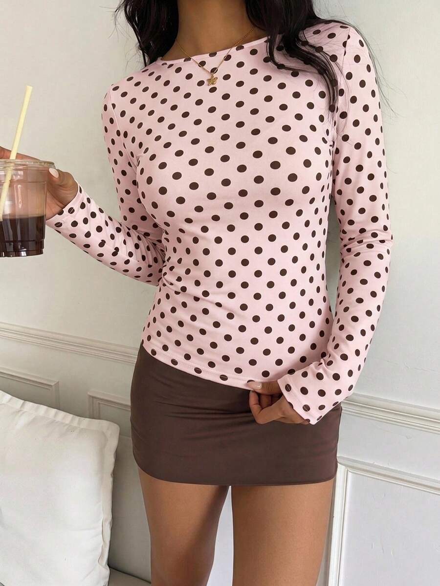 Casual CovetEZ long sleeve T-shirt with leopard-style random print, round neck, loose fit, and asymmetrical detail
