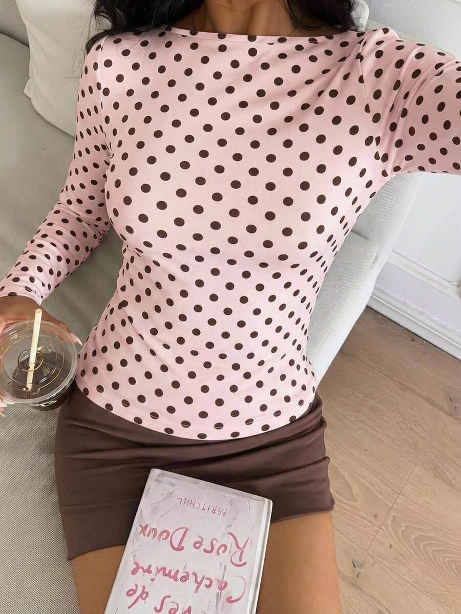 Casual CovetEZ long sleeve T-shirt with leopard-style random print, round neck, loose fit, and asymmetrical detail