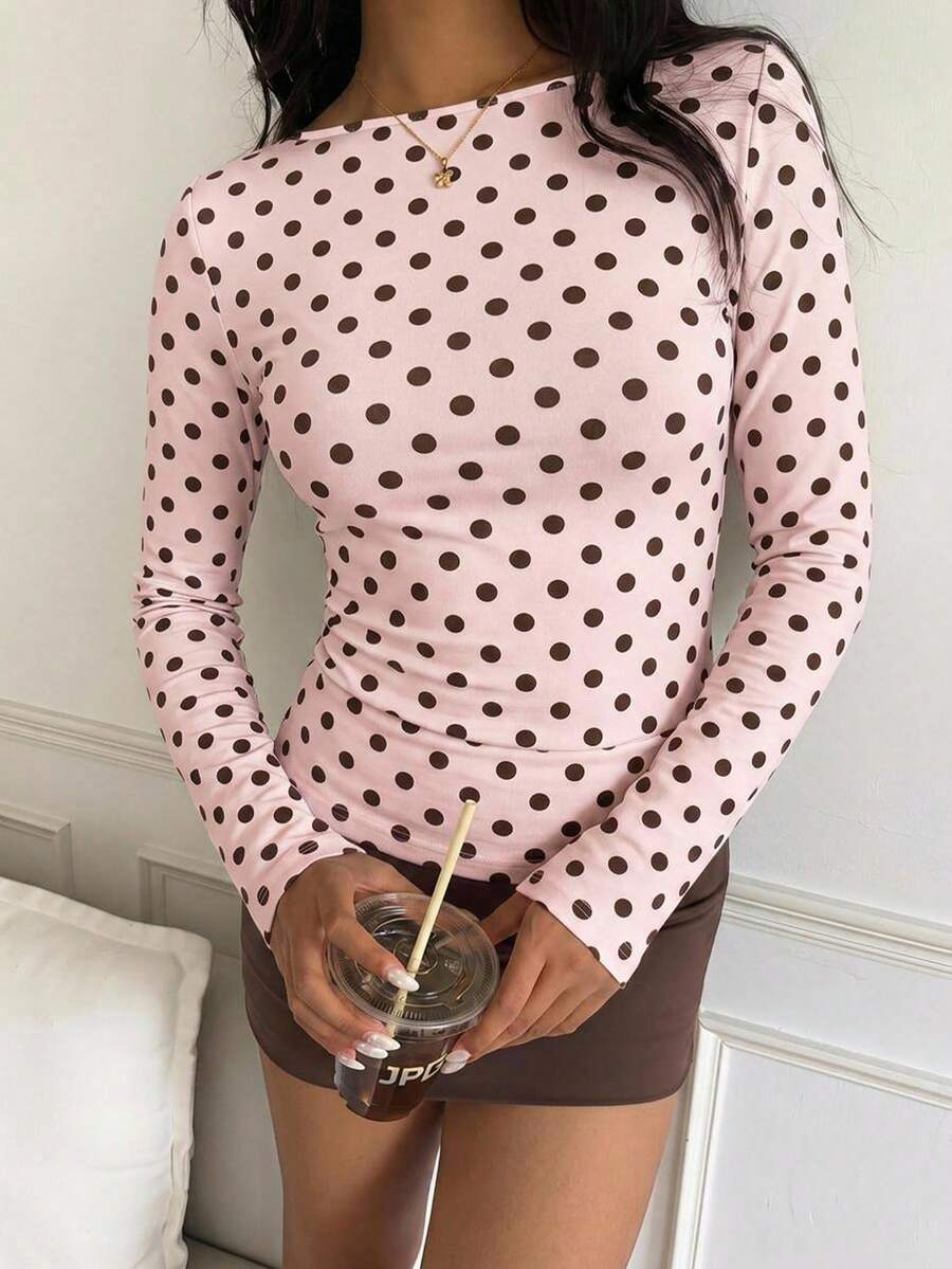 Casual CovetEZ long sleeve T-shirt with leopard-style random print, round neck, loose fit, and asymmetrical detail