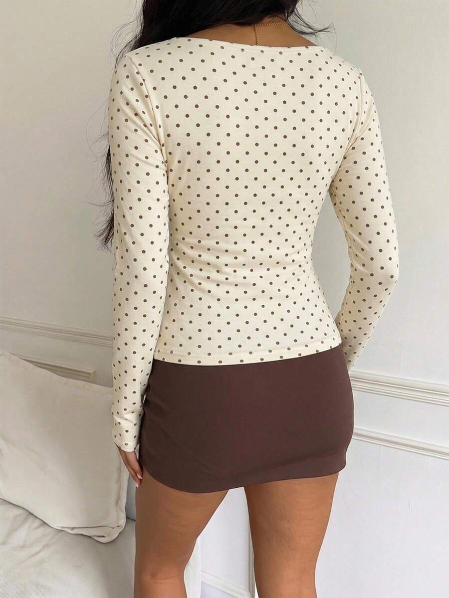Casual CovetEZ long sleeve T-shirt with leopard-style random print, round neck, loose fit, and asymmetrical detail