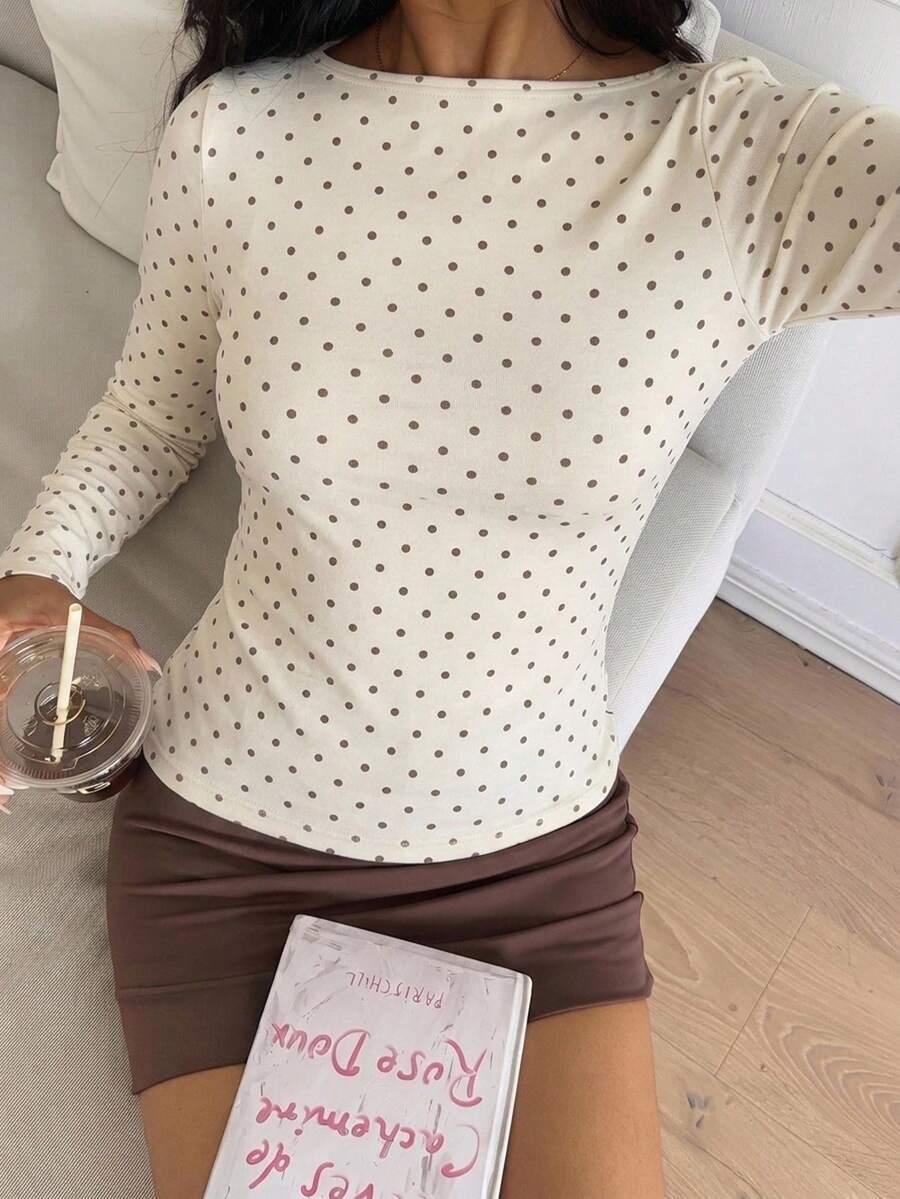 Casual CovetEZ long sleeve T-shirt with leopard-style random print, round neck, loose fit, and asymmetrical detail