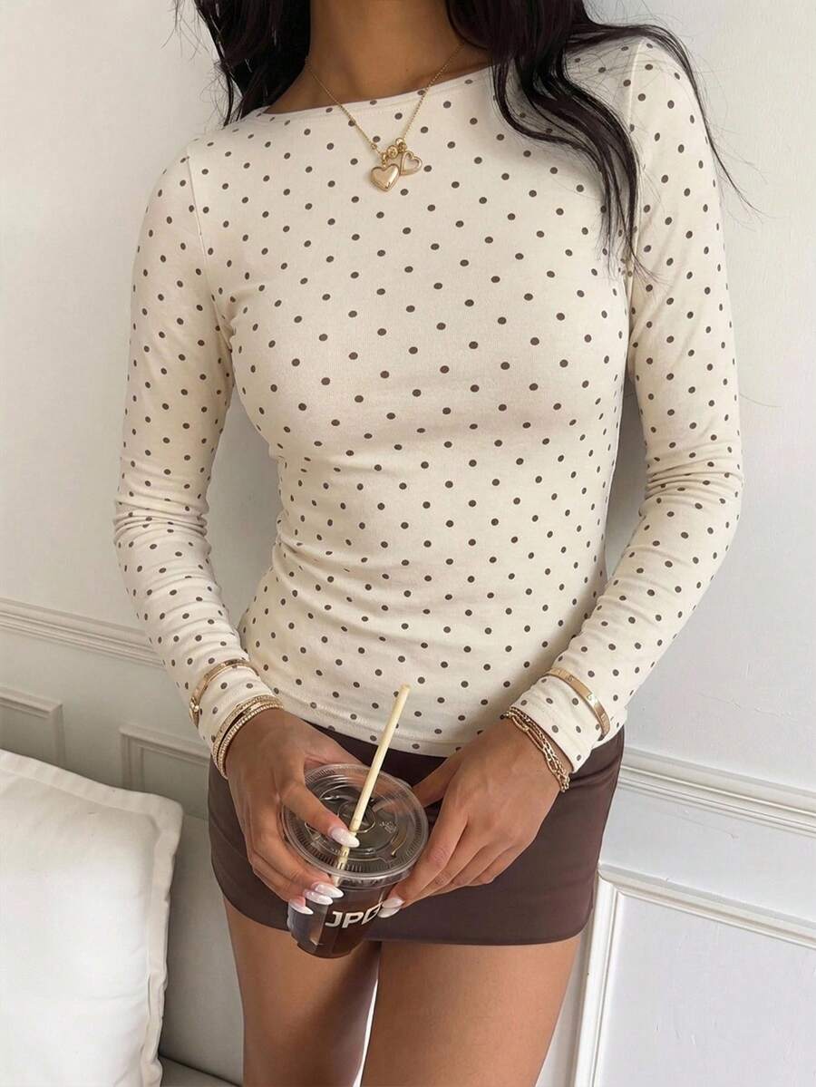Casual CovetEZ long sleeve T-shirt with leopard-style random print, round neck, loose fit, and asymmetrical detail