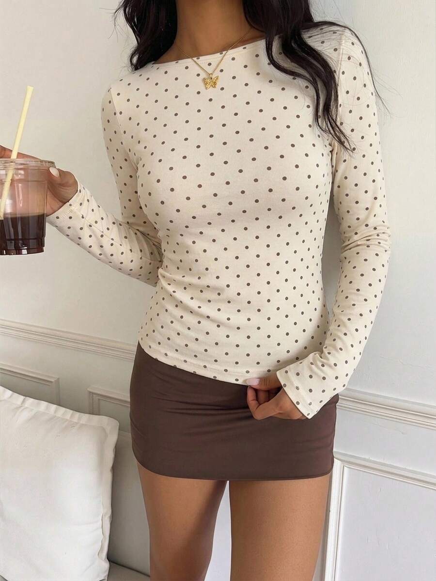 Casual CovetEZ long sleeve T-shirt with leopard-style random print, round neck, loose fit, and asymmetrical detail
