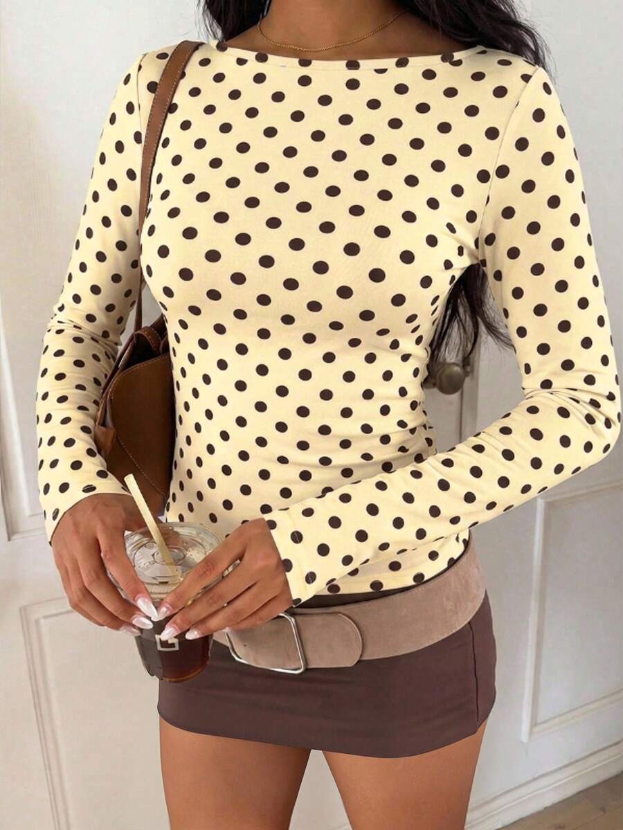 Casual CovetEZ long sleeve T-shirt with leopard-style random print, round neck, loose fit, and asymmetrical detail