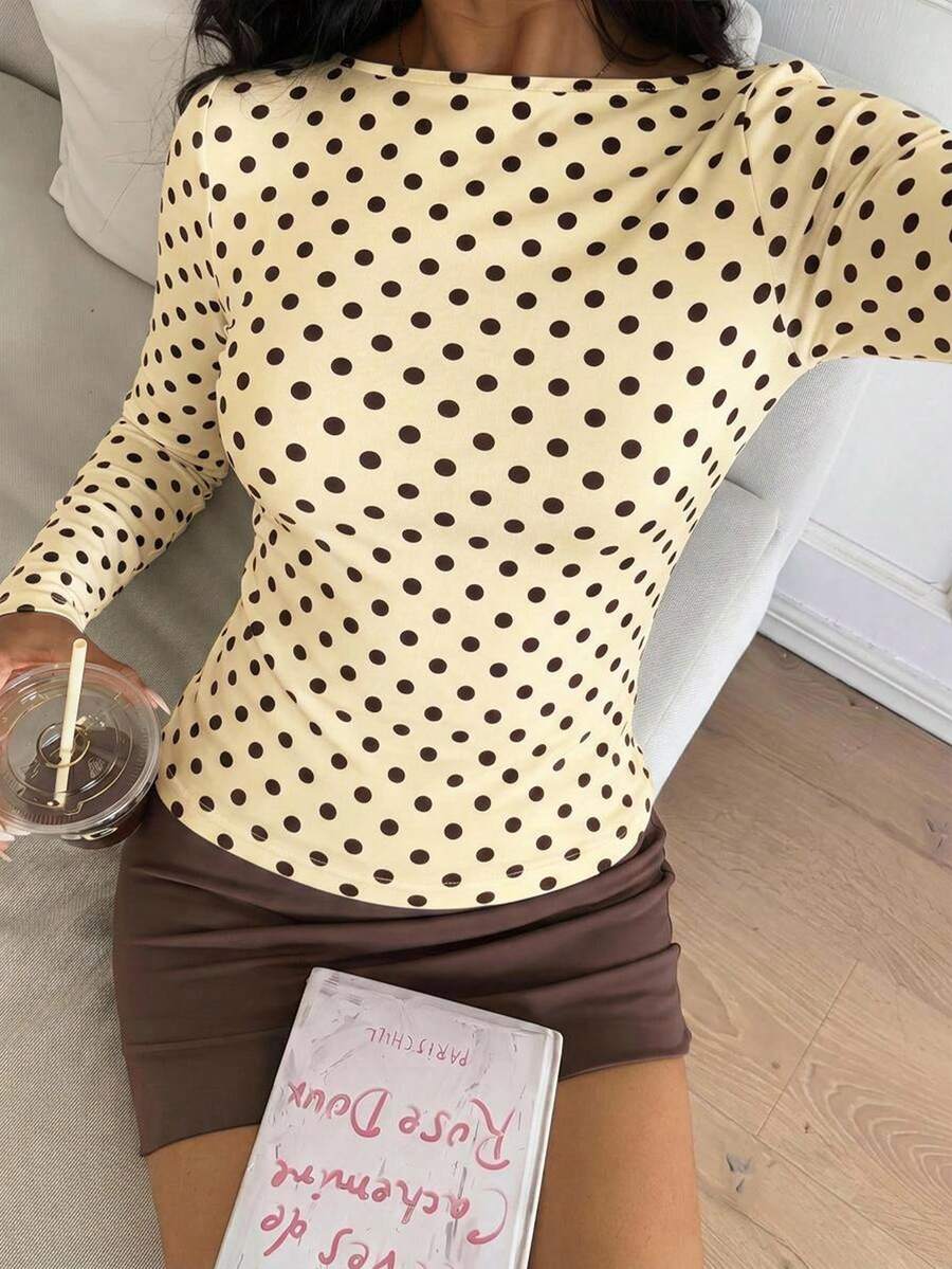 Casual CovetEZ long sleeve T-shirt with leopard-style random print, round neck, loose fit, and asymmetrical detail