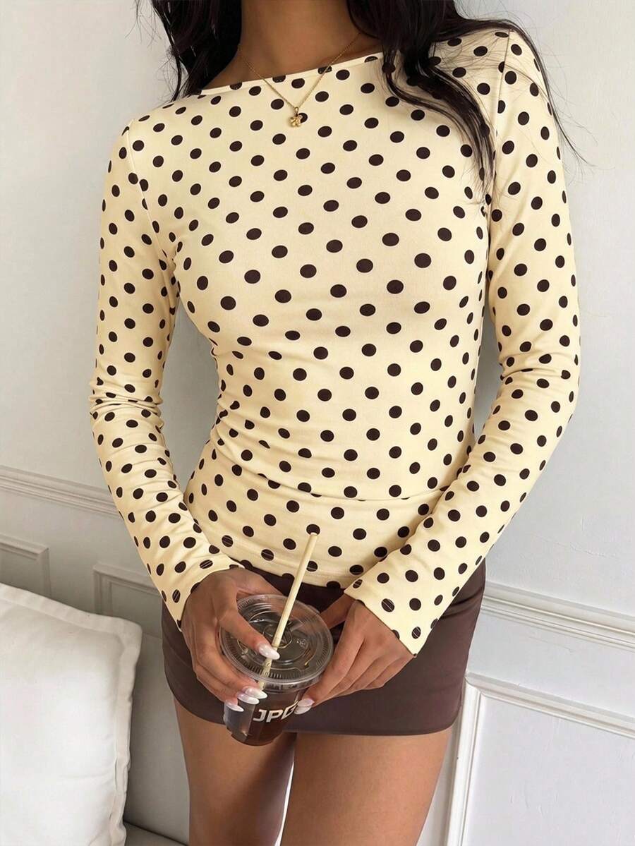 Casual CovetEZ long sleeve T-shirt with leopard-style random print, round neck, loose fit, and asymmetrical detail