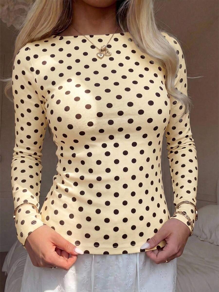 Casual CovetEZ long sleeve T-shirt with leopard-style random print, round neck, loose fit, and asymmetrical detail