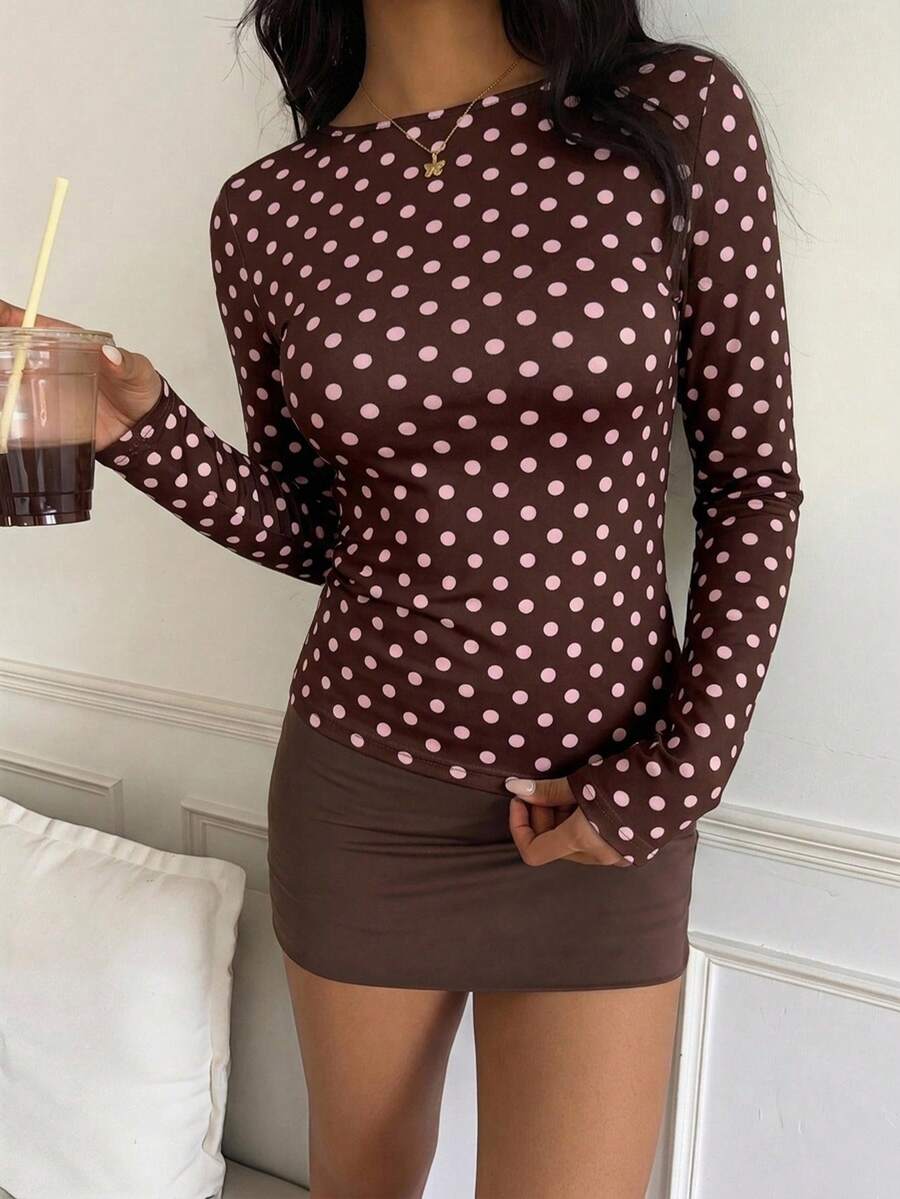 Casual CovetEZ long sleeve T-shirt with leopard-style random print, round neck, loose fit, and asymmetrical detail