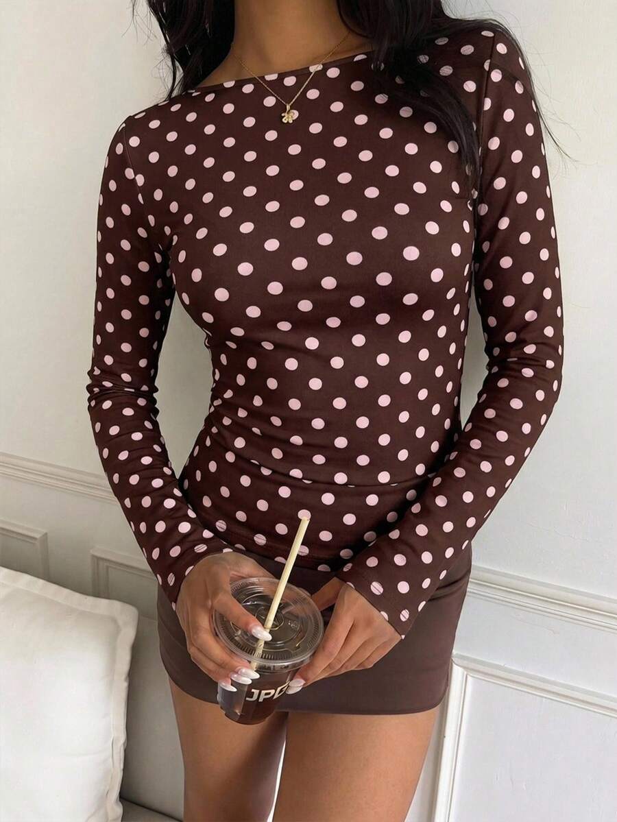 Casual CovetEZ long sleeve T-shirt with leopard-style random print, round neck, loose fit, and asymmetrical detail