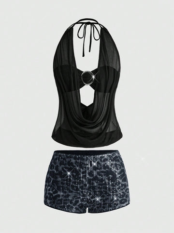 Women's two-piece outfit with a sleeveless halter cowl neck backless crop camisole, tie-back detail, bandeau inner, and leopard print shorts.