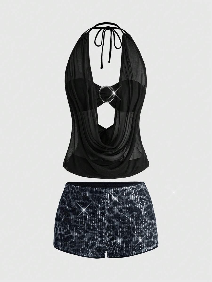 Women's two-piece outfit with a sleeveless halter cowl neck backless crop camisole, tie-back detail, bandeau inner, and leopard print shorts.