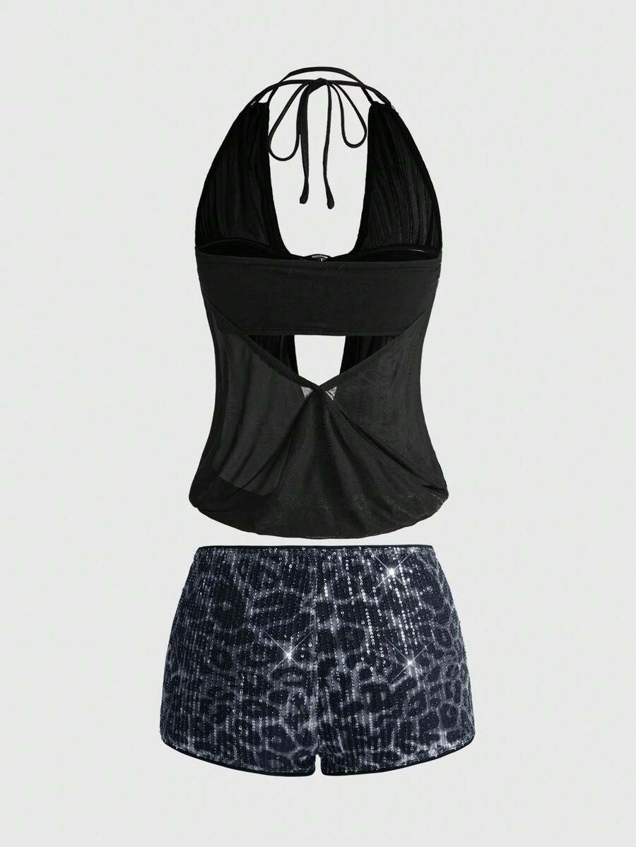 Women's two-piece outfit with a sleeveless halter cowl neck backless crop camisole, tie-back detail, bandeau inner, and leopard print shorts.