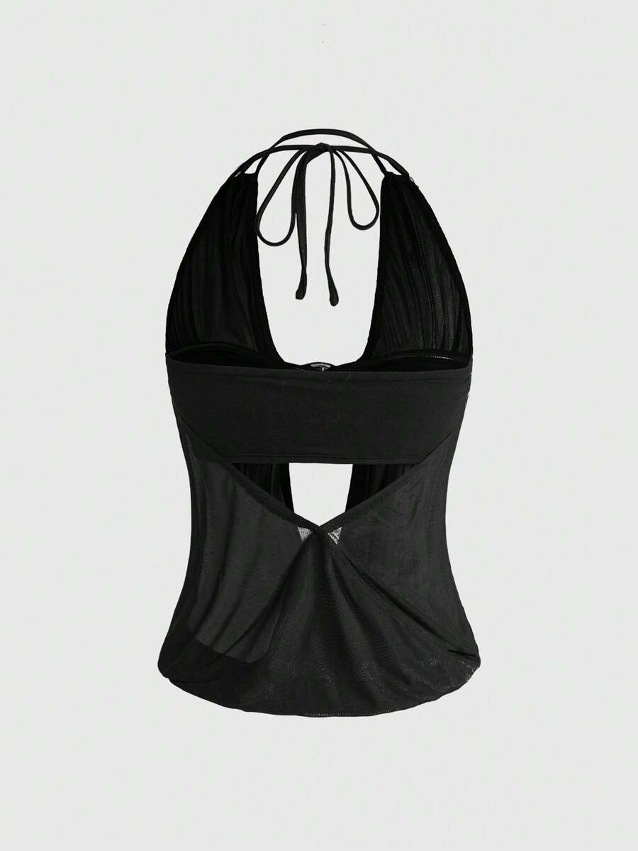 Women's two-piece outfit with a sleeveless halter cowl neck backless crop camisole, tie-back detail, bandeau inner, and leopard print shorts.