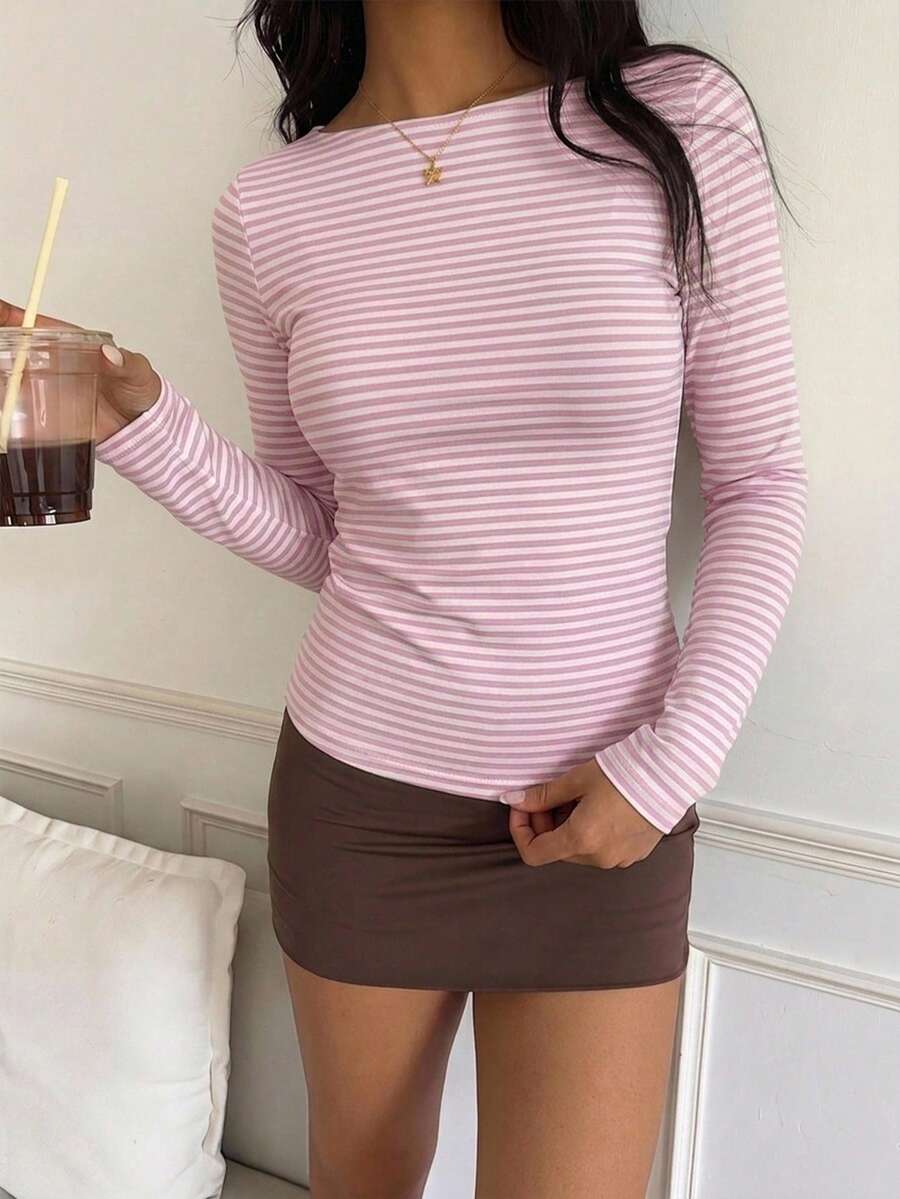 Casual CovetEZ long sleeve T-shirt with leopard-style random print, round neck, loose fit, and asymmetrical detail