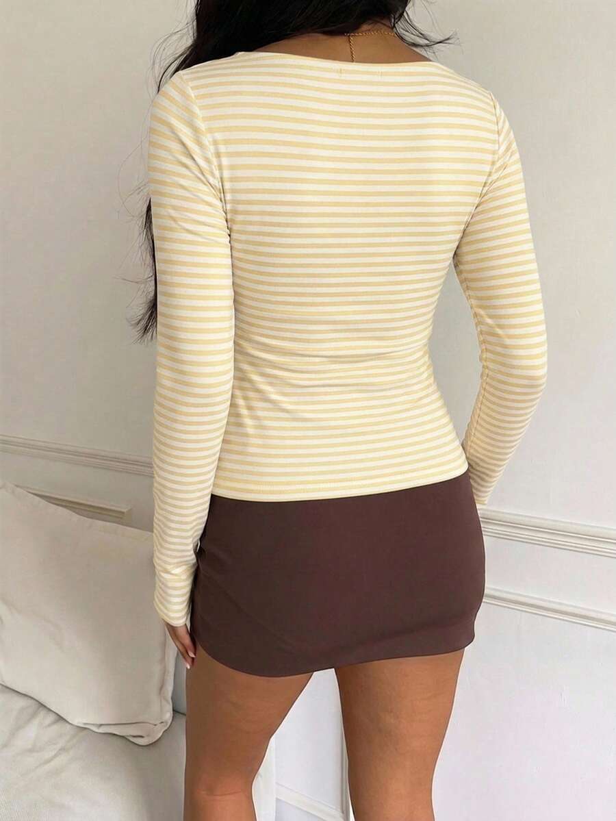 Casual CovetEZ long sleeve T-shirt with leopard-style random print, round neck, loose fit, and asymmetrical detail