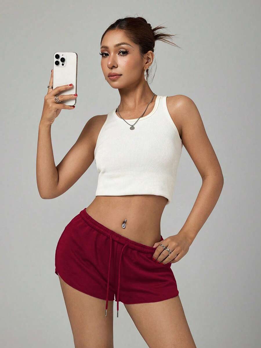 Petite women's burgundy casual track shorts with drawstring waist, raw hem, loose fit, and mini length