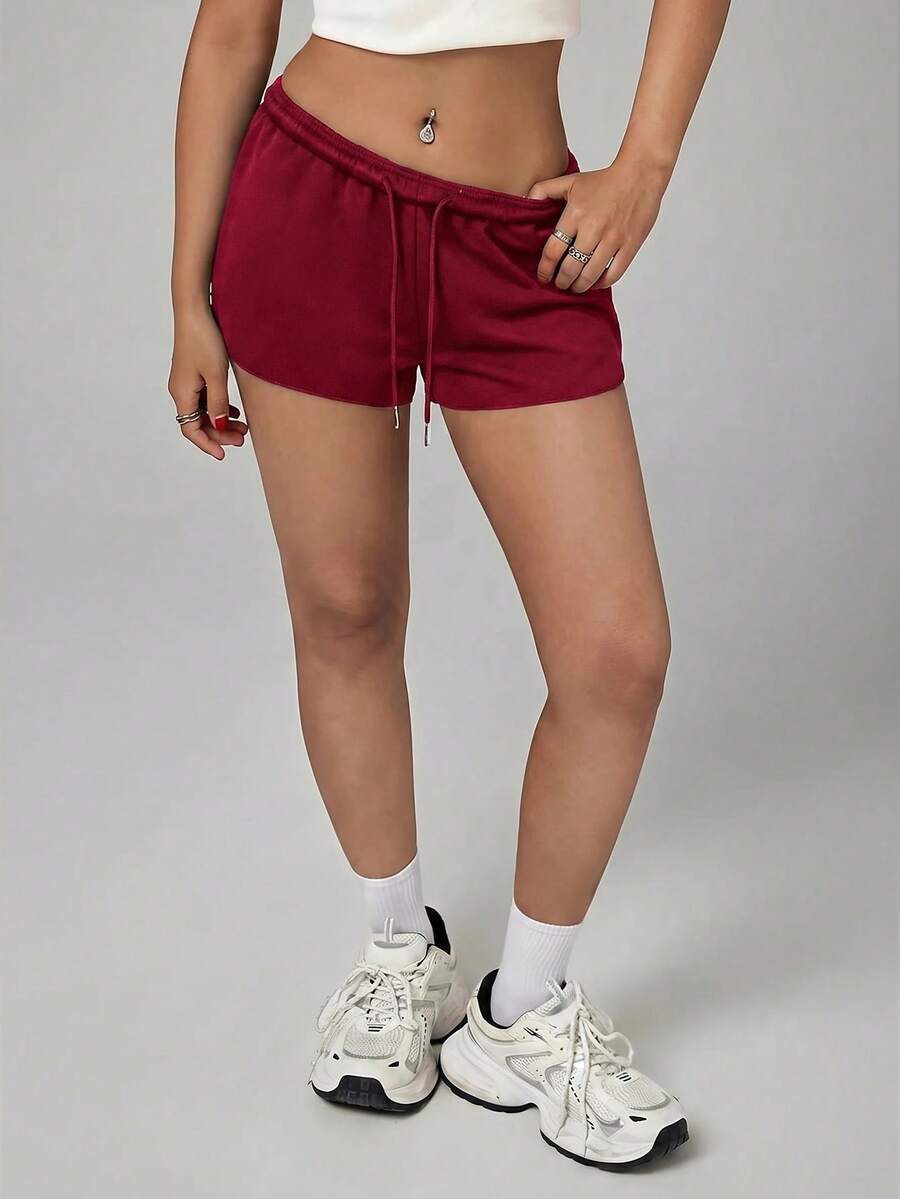 Petite women's burgundy casual track shorts with drawstring waist, raw hem, loose fit, and mini length