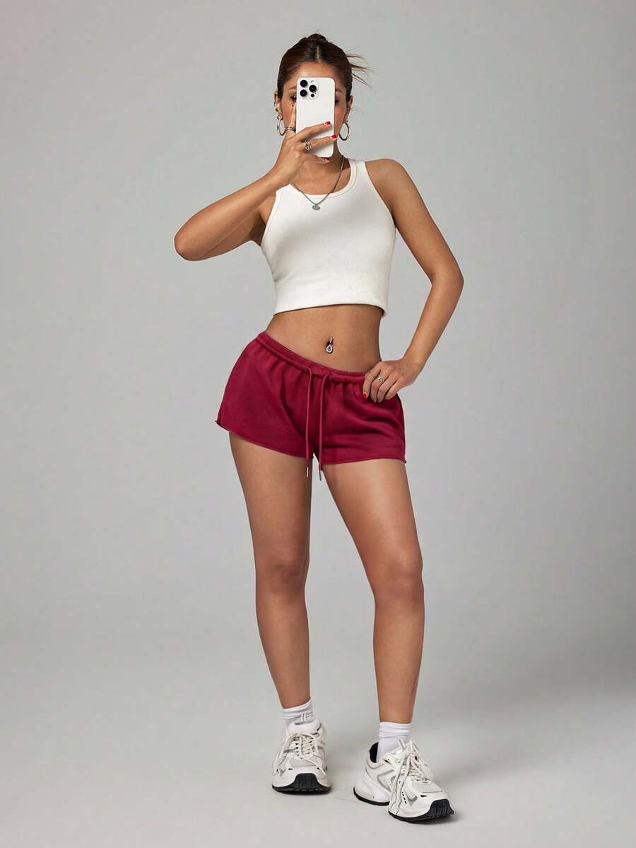 Petite women's burgundy casual track shorts with drawstring waist, raw hem, loose fit, and mini length