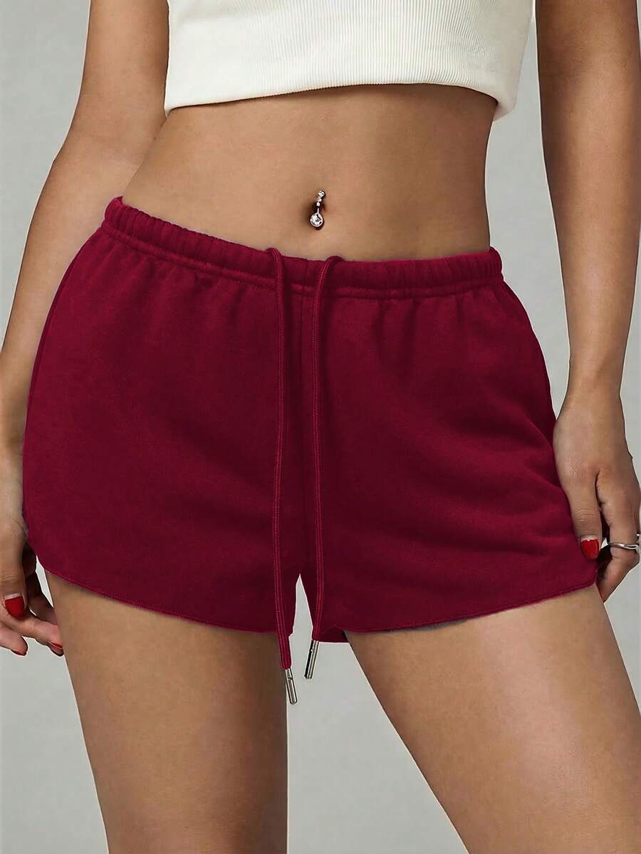 Petite women's burgundy casual track shorts with drawstring waist, raw hem, loose fit, and mini length